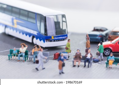 Miniature Travellers At A Busy Bus Station