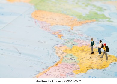 Miniature travellers on the world map heading for holidays - Powered by Shutterstock