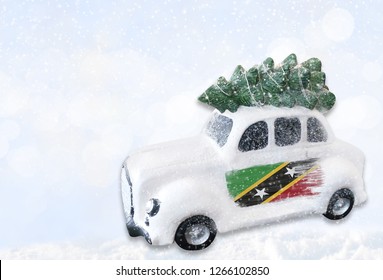 A Miniature White Christmas Car With A Flag Of Saint Kitts And Nevis.