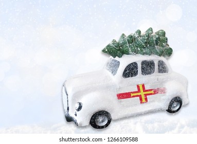 A Miniature White Christmas Car With A Flag Of Guernsey.