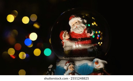 Miniature winter scene inside snow globe, featuring Santa and holiday tree, brings cozy charm of fairy-tale Christmas into any space, creating magical seasonal ambiance. Christmas spirit concept
 - Powered by Shutterstock