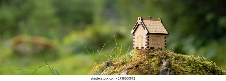 Miniature Wooden House . The Concept Of Buying A House Or Apartment. Affordable Housing. Profitable And Cheap Loans For Real Estate. Buying A Home. Mortgage And Loan. Place For Text