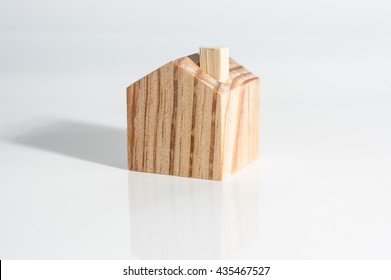 Miniature Wooden House On White Background