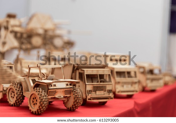 miniature\
wooden mechanical car gears on the\
table.