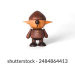 miniature wooden statue of a dwarf on a white background