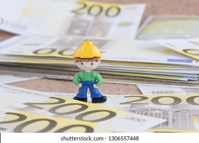 Miniature Worker On 200 Euro Money