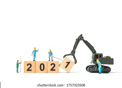 Miniature Worker Team Create Wooden Block Number 2021 , Happy New Year Concept