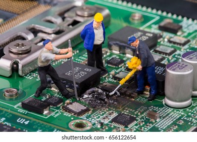 miniature workers on a computer mainboard - studio shot - Powered by Shutterstock