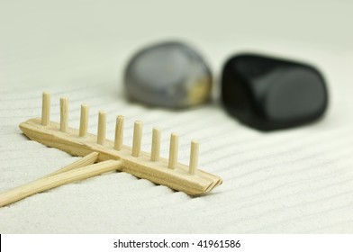 Miniature Zen Garden With Two Stones And Wooden Rake