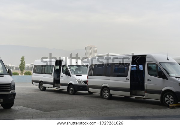 minibuses with open
doors on city bus
station