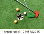 Mini-golf ball on artificial grass. Summer season game