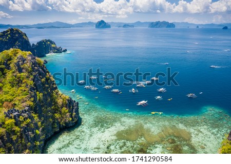 Similar – Image, Stock Photo Miniloc Island with limestone cliffs. Aerial drone panoramic picture. Bacuit Archipelago, El Nido, Palawan, Philippines