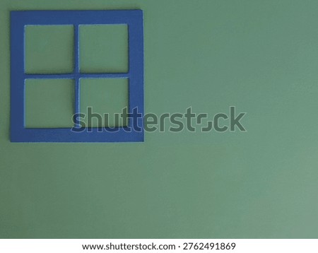 Minimal abstract architectural composition featuring a stylised blue window frame on a soft green background with copy space