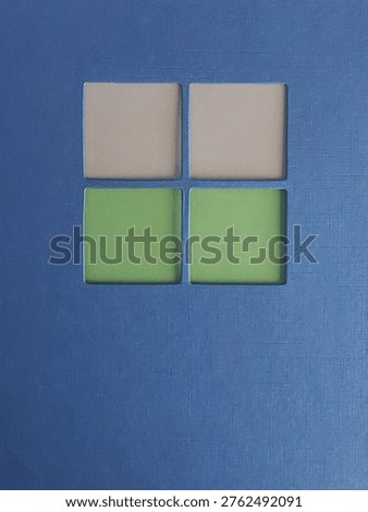 Minimal abstract architectural composition featuring cream and green window panes arranged in a stylised blue facade with copy space