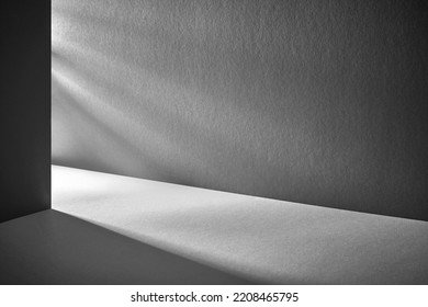 Minimal abstract black background for product presentation. Organic drop diagonal shadow and rays of light from window on a blue wallpaper - Shutterstock ID 2208465795