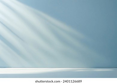 minimal abstract light blue background for product presentation. shadow and light from windows on plaster wall. - Powered by Shutterstock