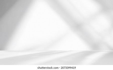 Minimal abstract light gray background for product presentation. Shadow and light from windows on plaster wall. - Shutterstock ID 2073399419