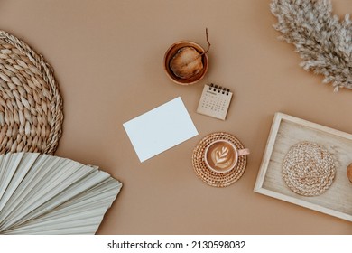 Minimal aesthetic business brand, blog, social media template. Blank card, coffee cup and dry leaves on neutral background. Flat lay, top view - Powered by Shutterstock