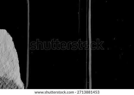 Minimal black background with thin white vertical scratches creating linear distressed texture.