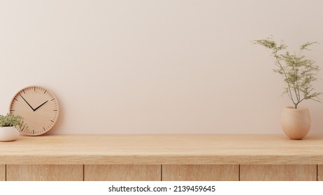 Minimal cozy counter mockup design for product presentation background or branding in Japan style with bright wood counter and warm white wall include vase plant and clock. Kitchen interior 