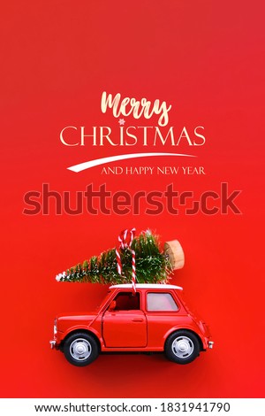 Minimal design for celebrating christmas or new year greeting card. Gift delivery concept. Little red toy car and Christmas tree on a red background