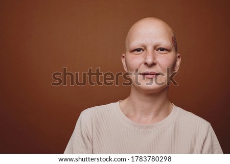 Similar – Image, Stock Photo Portrait of confident bald young woman wearing bright orange jacket in studio