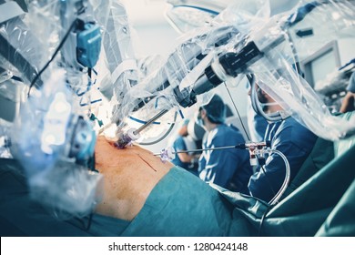 Minimal Invasive Robot Surgical System In Hospital. Robotic Technology Equipment, Machine Arm Surgeon In Futuristic Operation Room. Medical Inovation 3D View Endoscopy For Robot Surgery In Healthcare