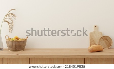 Minimal kitchen counter mock up design for product presentation background or branding with wood counter white wall include vase with rice plant chopping block bread and  fruit basket. Food table.