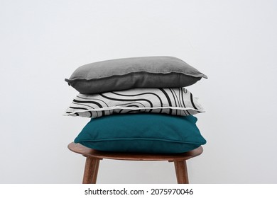 Minimal linen cushion covers on a chair - Shutterstock ID 2075970046