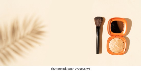 Minimal modern cosmetic scene with make up brushes, bronzer and shadow overlay, web banner format