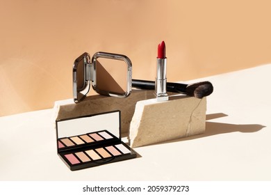 Minimal Modern Cosmetic Scene With Make Up Brushes, Eye Shadows Palette, Lipstick, Neutral Beige Background