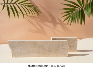 Minimal modern product display on beige background with podium with palm leaves - Shutterstock ID 1810417933