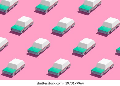 Minimal Retro Future Car Concept Pattern With Teal Green Cars On Bright Vibrant Neon Pink Background. Trendy Bold Summer Travel And Road Trip Idea. Retro Aesthetic.