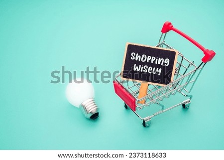 Minimal shopping cart with glowing light bulb and wooden sign, as tips for shopping wisely concept