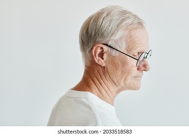 Minimal Side View Portrait Of White Haired Senior Man On White Background, Copy Space