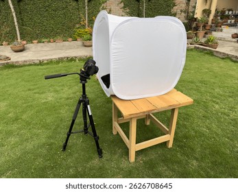 Minimal studio box on table for isolated object photography in natural light outdoor setup