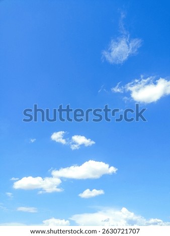 Minimal style background image, clear sky with few floating clouds, beautiful and natural.
