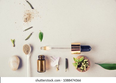 The minimal style. Natural cosmetics, vegetable serum, handmade skin and body care. Glass bottle and vegetable ingredients. Flat lay. - Powered by Shutterstock