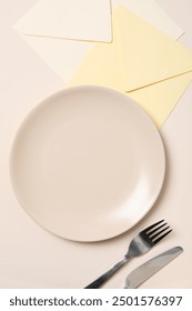 Minimal table setting with blank dish, top view