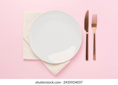 Minimal table setting on color background, top view - Powered by Shutterstock