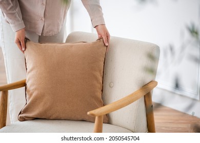 Minimal Velvet Cushion Brown In Beige On An Armchair