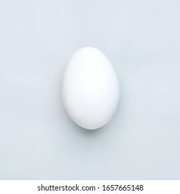 Minimal white easter egg on gray background, flat lay - Shutterstock ID 1657665148