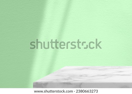 Minimal White Marble Table Corner with Shadow and Palegreen Beam on Concrete Wall Background, Suitable for Product Presentation Backdrop, Display, and Mock up.