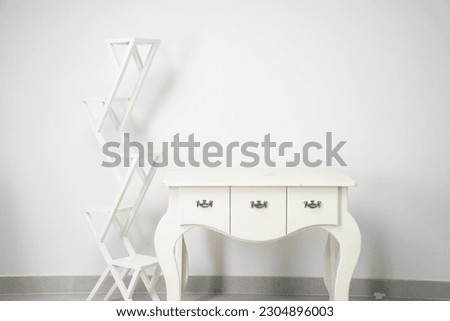 Minimal White theme background with a table and side stand