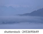 Minimal winter foggy sunrise with vibrant colours, Sankt Veit an der Glan, Carinthia, Austria 