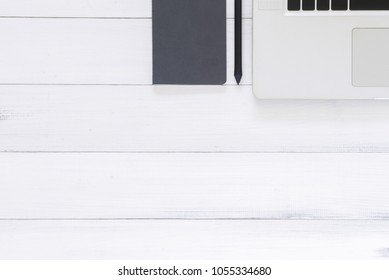 Minimal work space - Creative flat lay photo of workspace desk. Top view office desk with laptop, mock up notebooks on white wooden background. Top view with copy space, flat lay photography