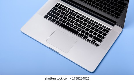 Minimal Work Space - Creative Flat Lay Photo Of Workspace Desk. Top View Office Desk With Laptop,  On Blue Color Background. Top View With Copy Space, Flat Lay Photography.