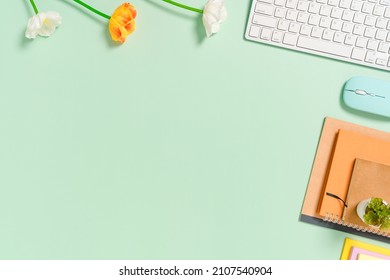 Minimal work space - Creative flat lay photo of workspace desk. Top view office desk with keyboard, mouse and notebook on pastel green color background. Top view with copy space, flat lay photography. - Shutterstock ID 2107540904