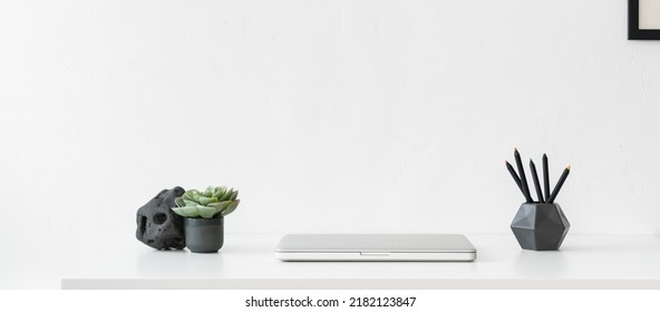 Minimal Workspace. Desk With Closed Laptop. Simple Workplace. 