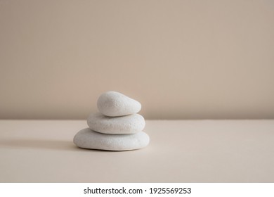 Minimal Zen Natural Beauty. Background For Branding And Product Presentation. Still Life Mock Up Photo Of White Marble Stones With Long Shadow On Beige Table.